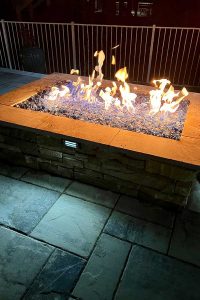 gas-fireplace-installation-glass-rock-led-lights-daltons-sprinklers-drainage-and-lighting-foley-alabama